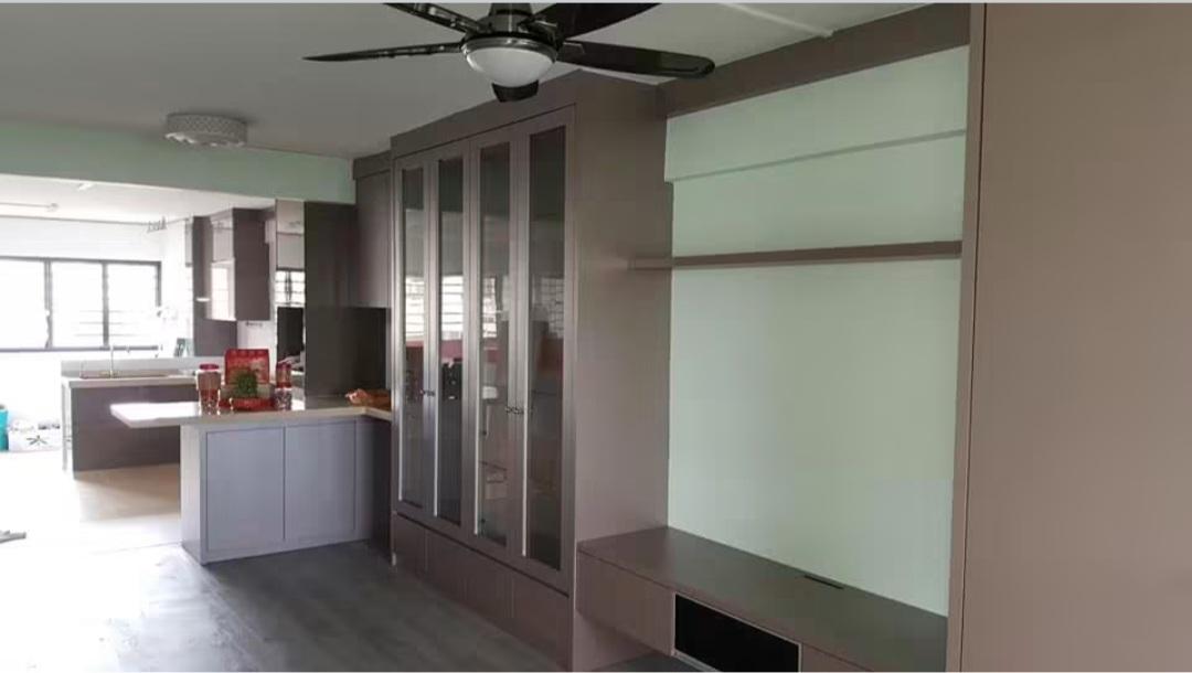 Living room with wardrobe, window and entrance door