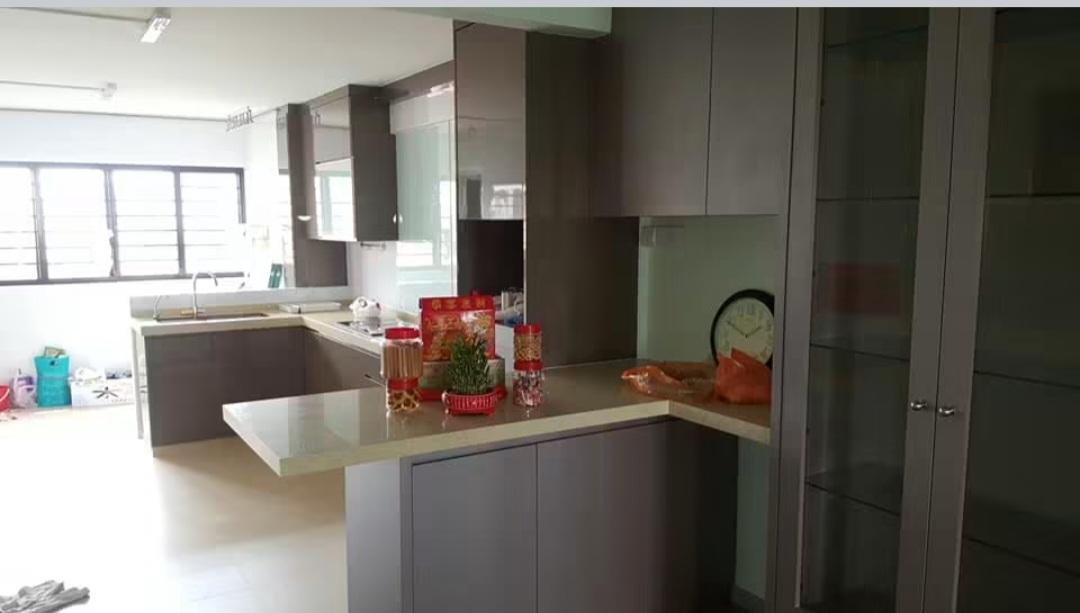 Kitchen with stainless steel fridge and cabinetry