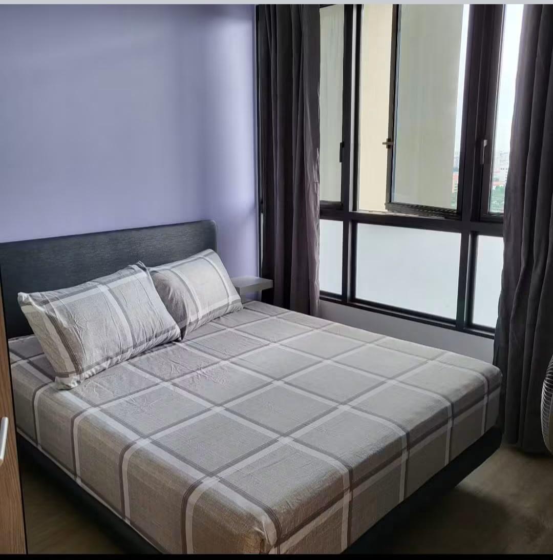 Bedroom with fan and view to living area
