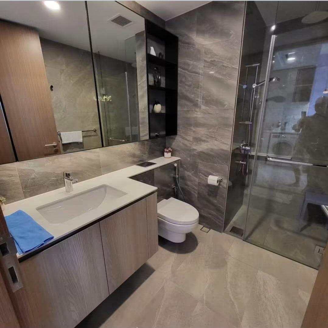 Marble TV feature wall with pendant lighting
