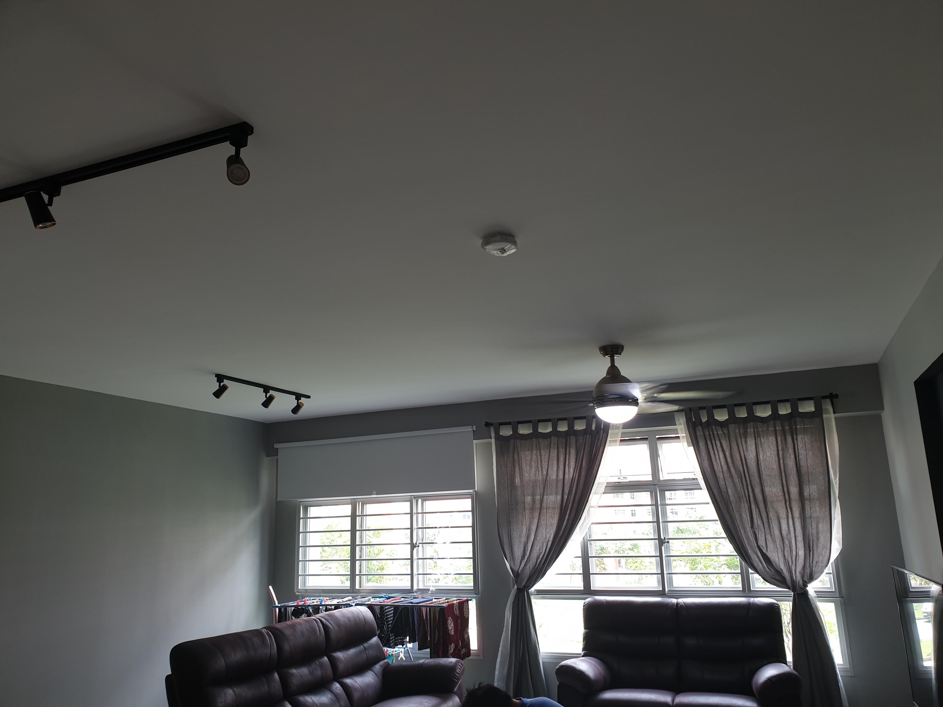 Living room with curtains and ceiling fan