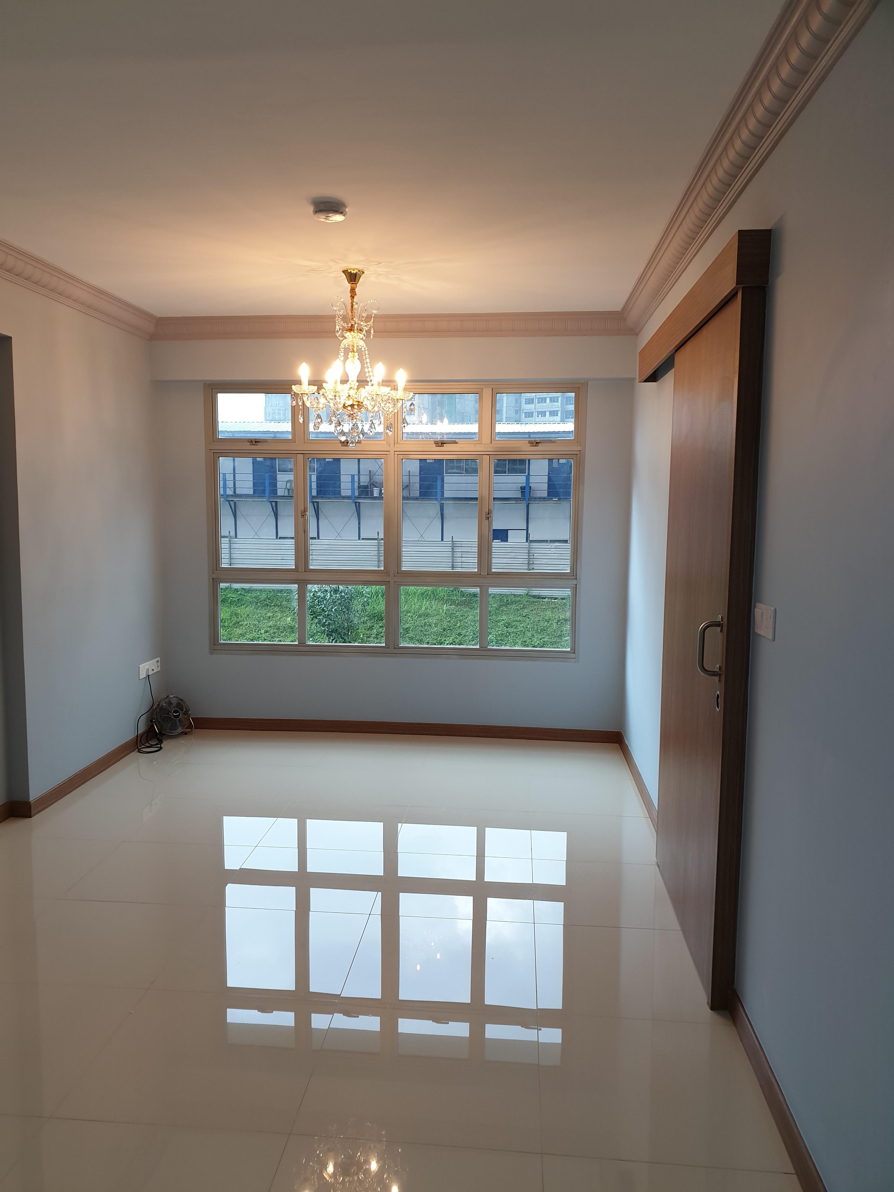 Living area with chandelier and sliding door
