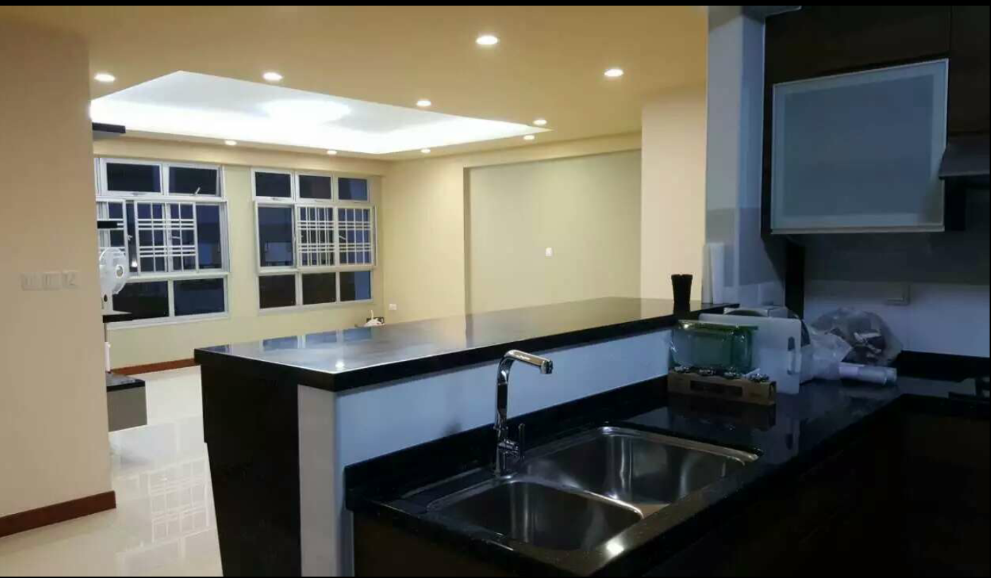Kitchen island counter with sink and window view
