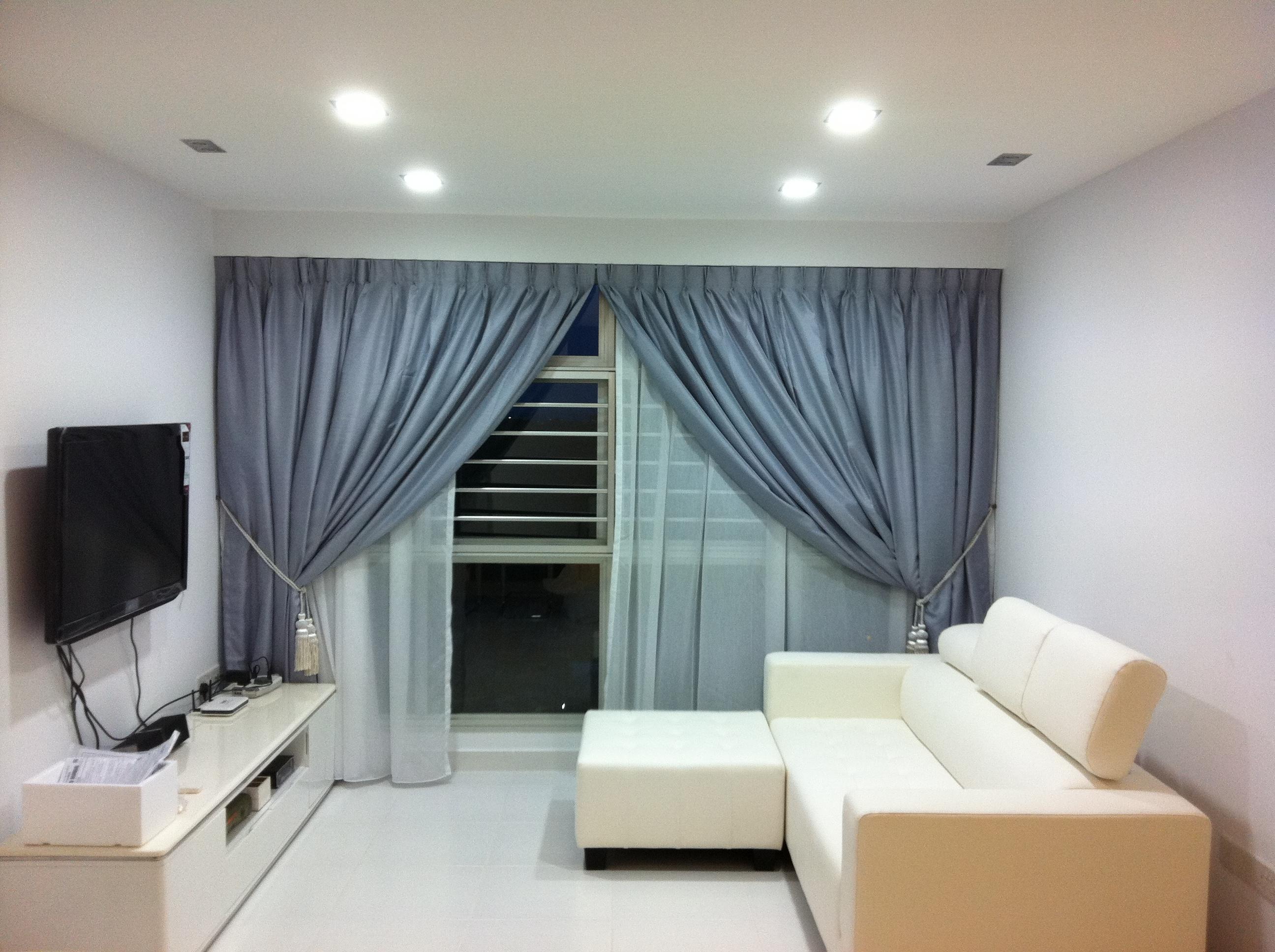 Living room with grey curtains and sofa