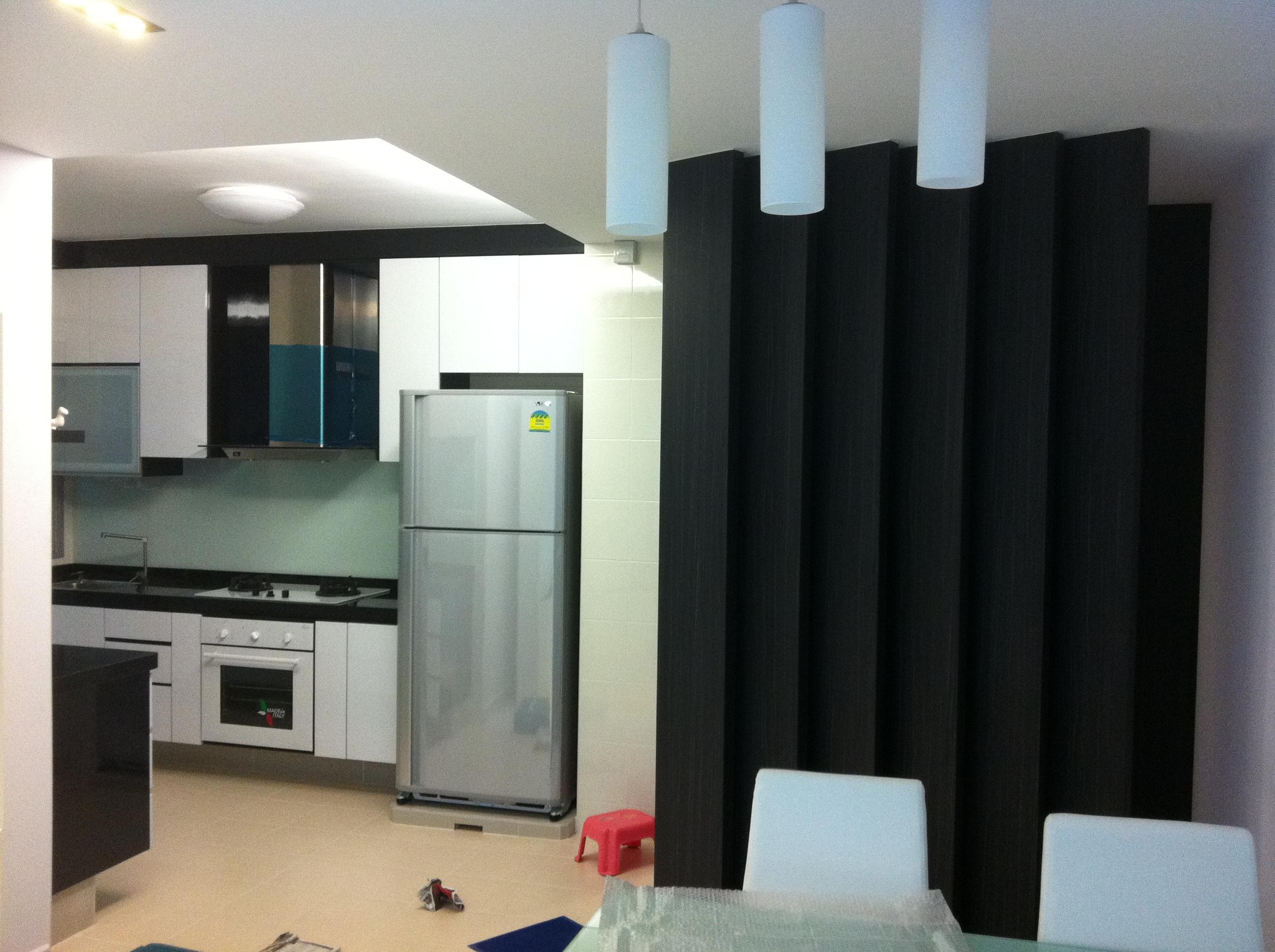 Kitchen with stainless fridge and feature partition