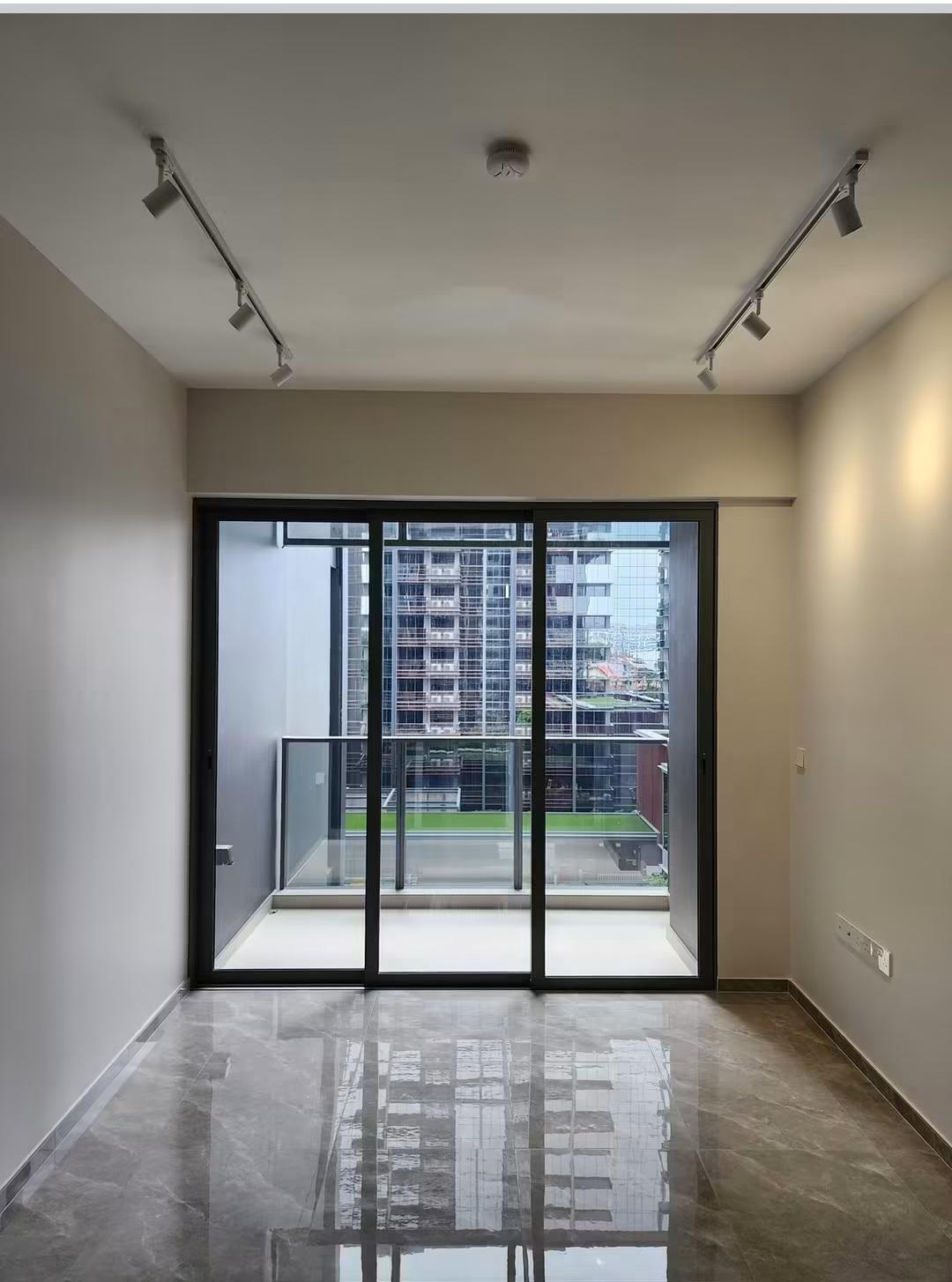 Hallway leading to white kitchen cabinetry