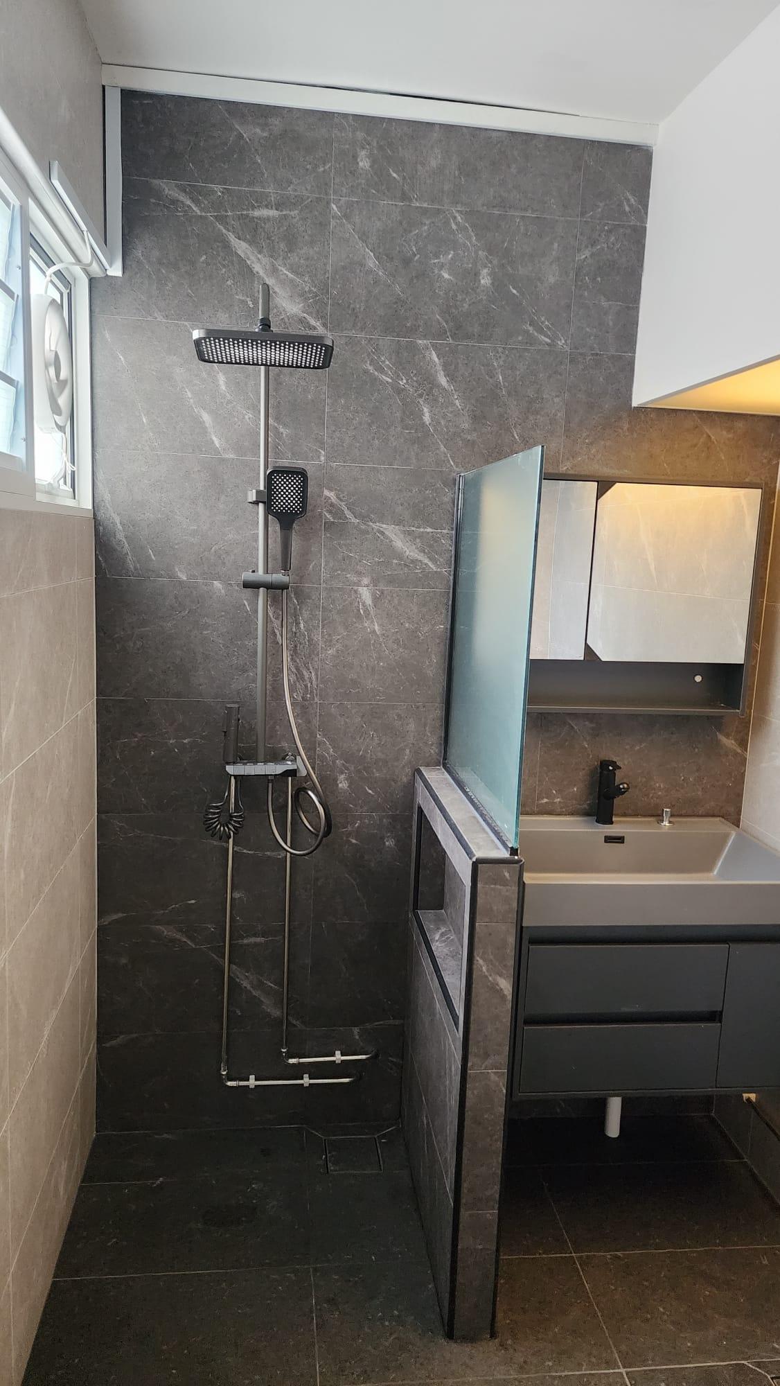 Bathroom shower with rain shower head and vanity