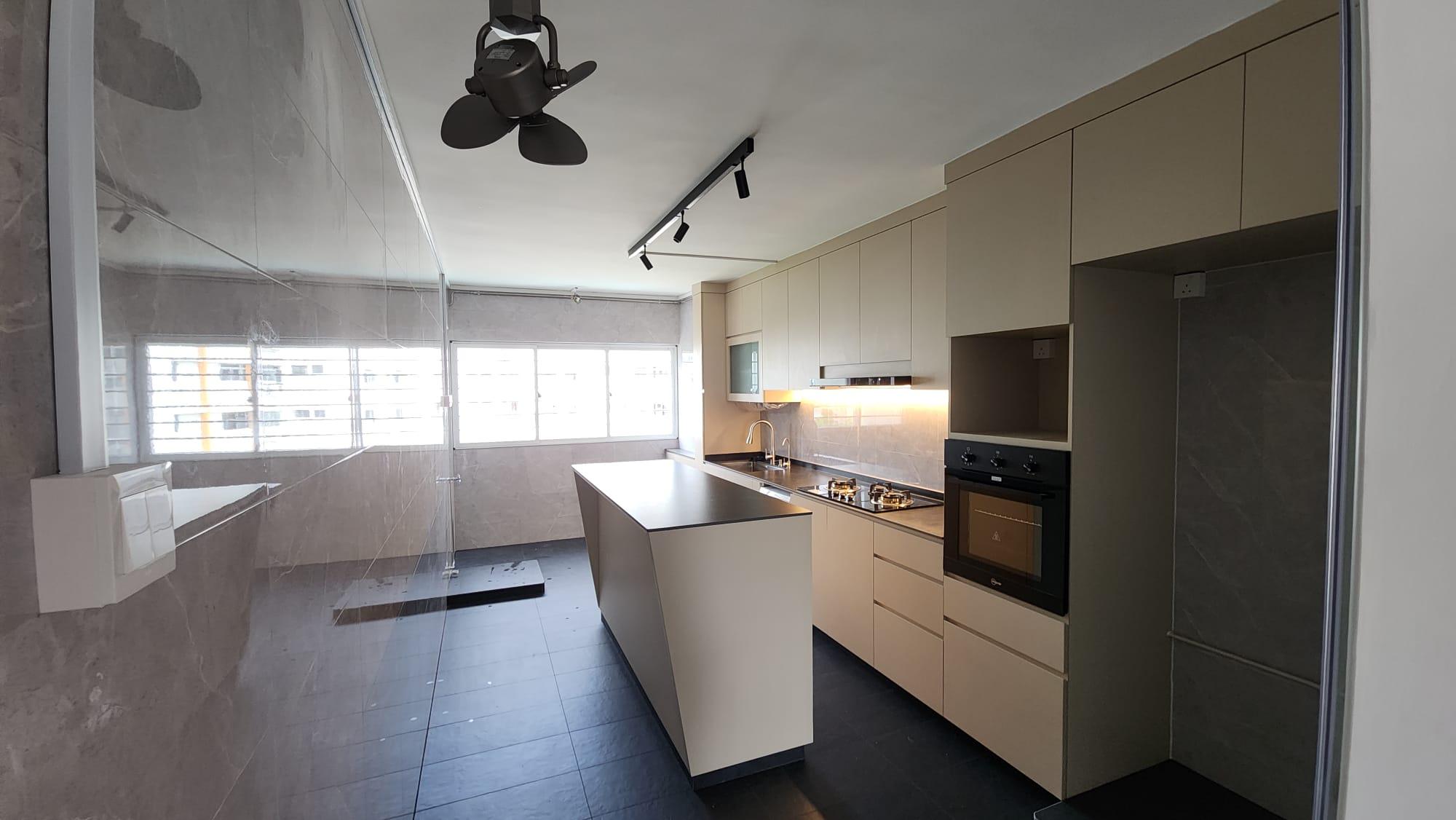 Kitchen island with hob, oven and cabinetry