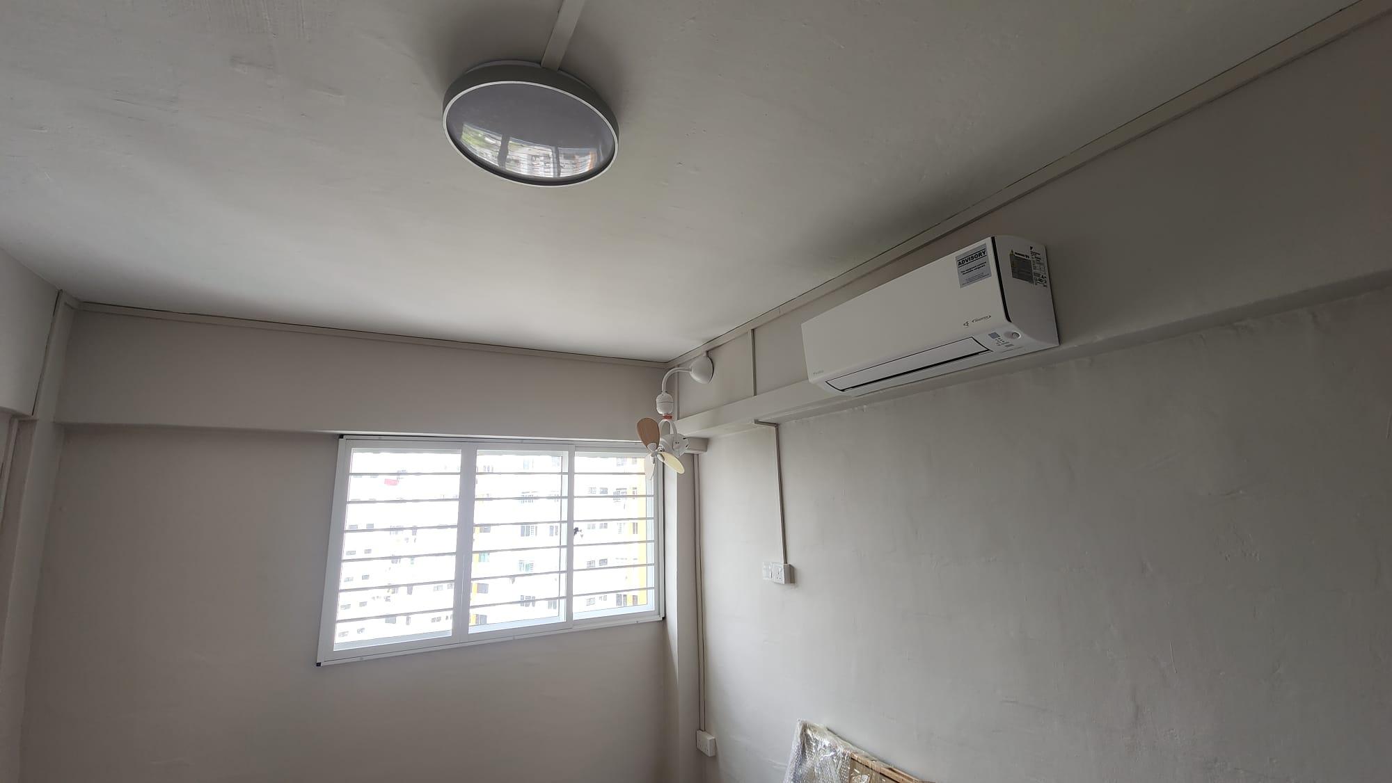 Bedroom with air-conditioning and window