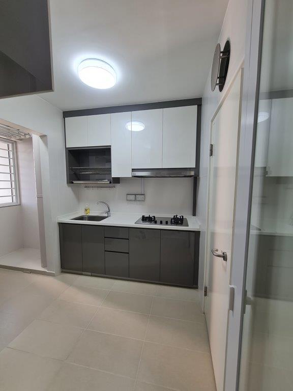 Kitchen with grey cabinetry and dish rack
