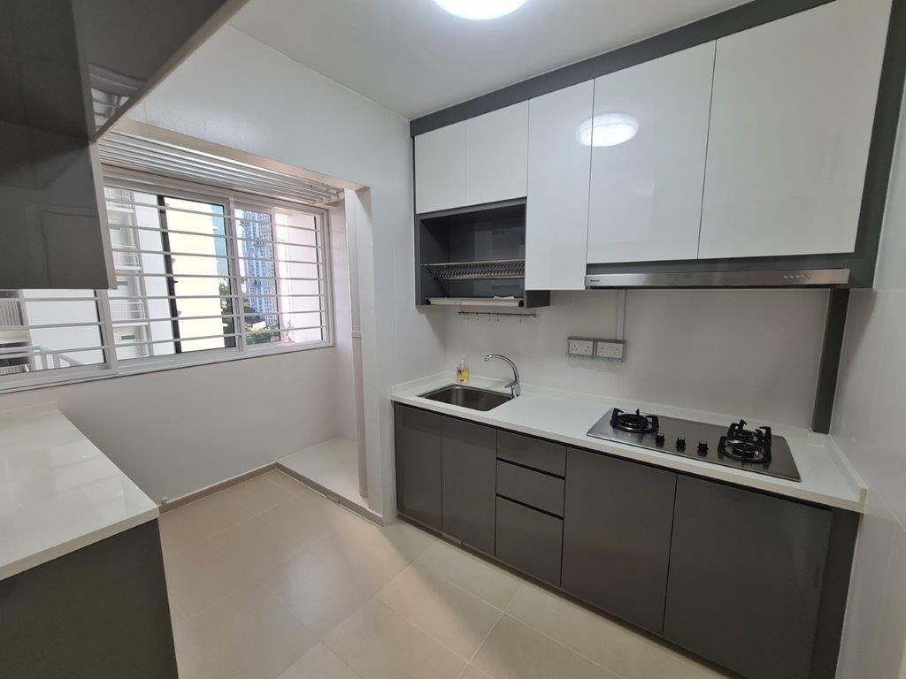 Kitchen with grey cabinetry and gas hob