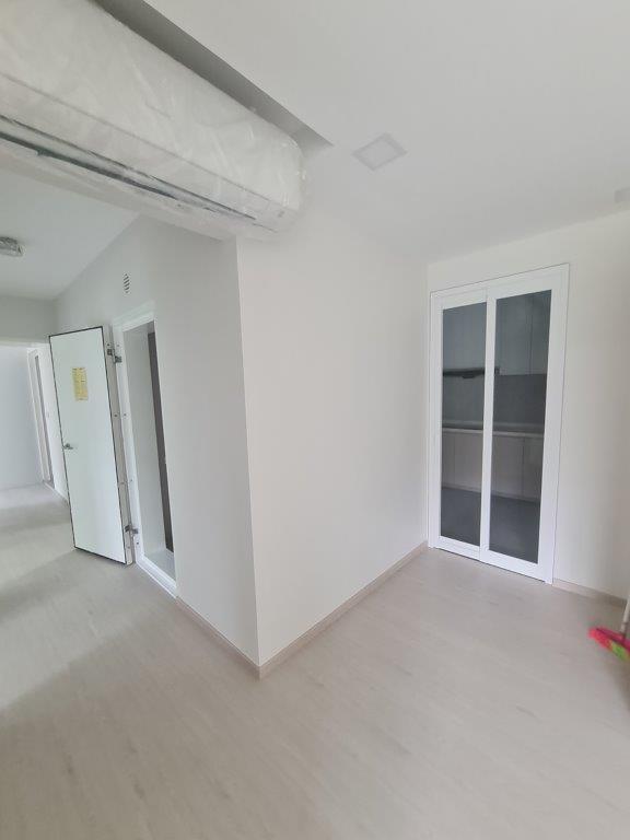 Hallway with storage cupboard and bathroom