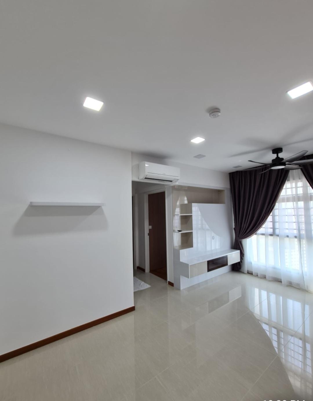 Living room with TV feature wall and curtains