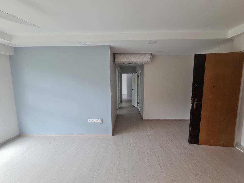 Hallway with blue wall and entrance door