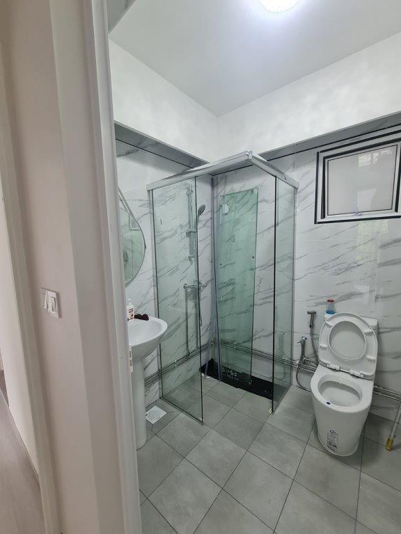 Bathroom with glass shower and toilet