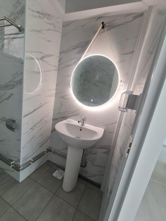 Bathroom vanity with round mirror