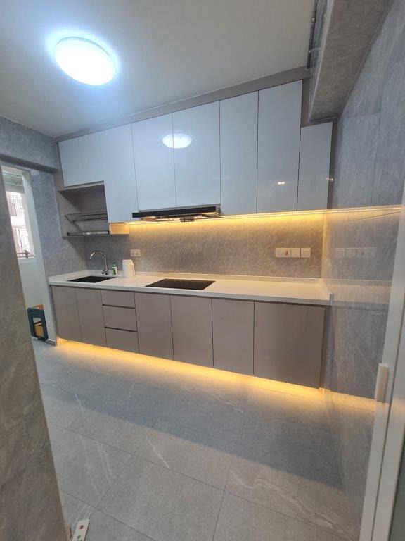 Kitchen with white cabinetry and under-cabinet lighting