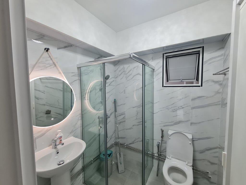 Bathroom vanity with mirror and glass shower