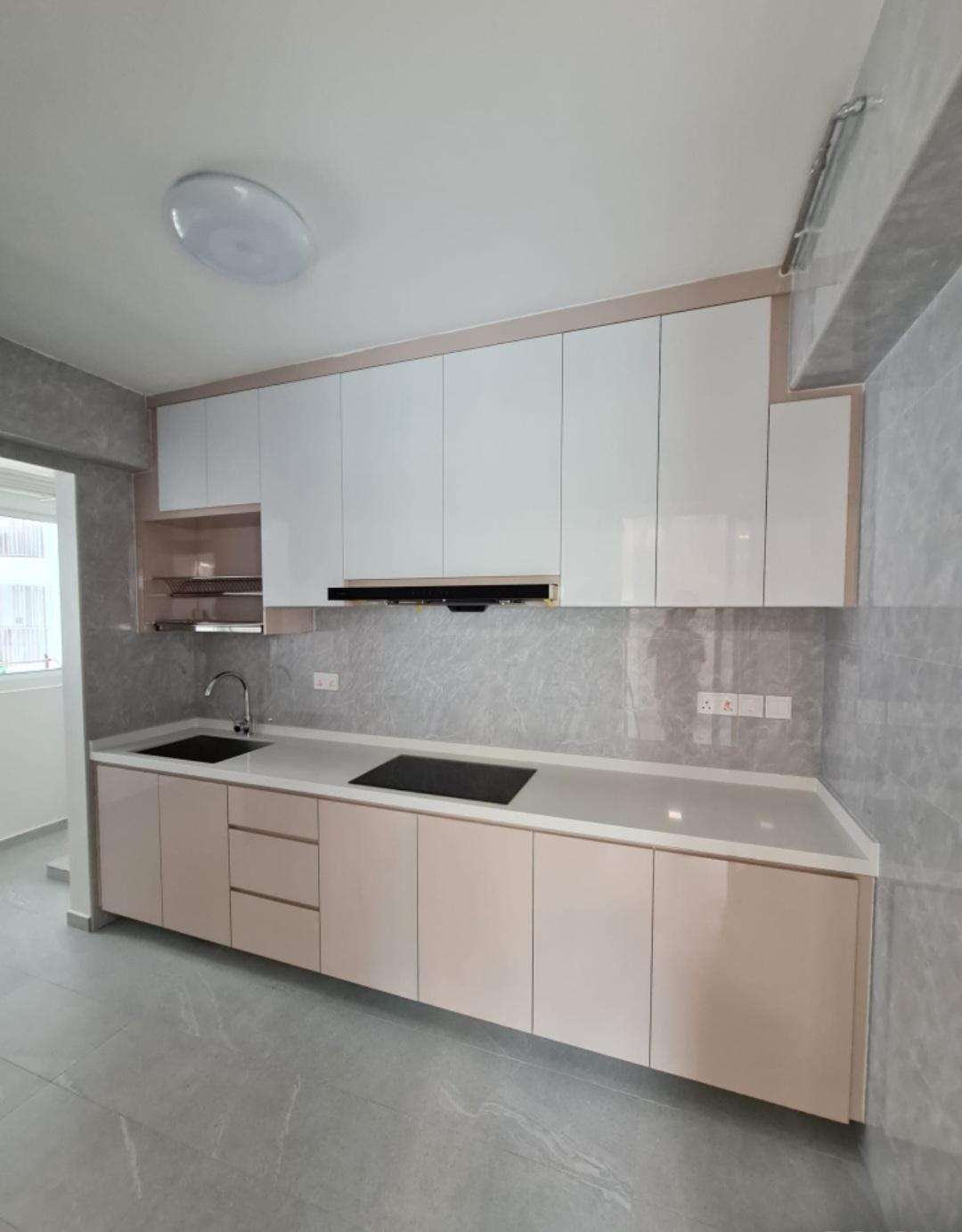 Kitchen cabinetry with marble backsplash