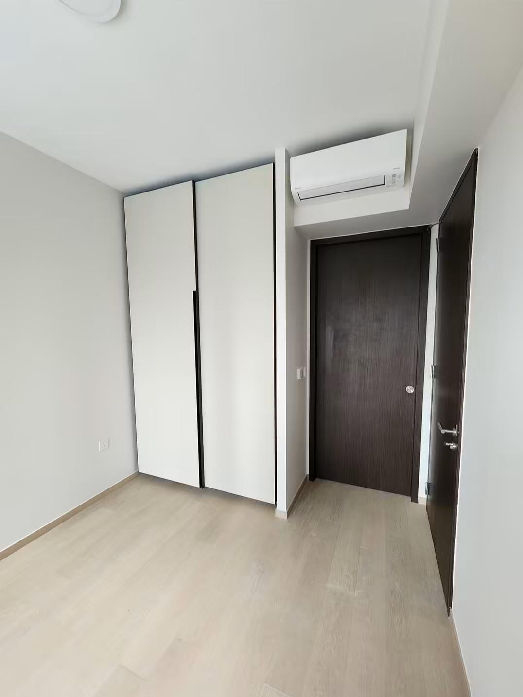 Bedroom with sliding wardrobe and door to hallway