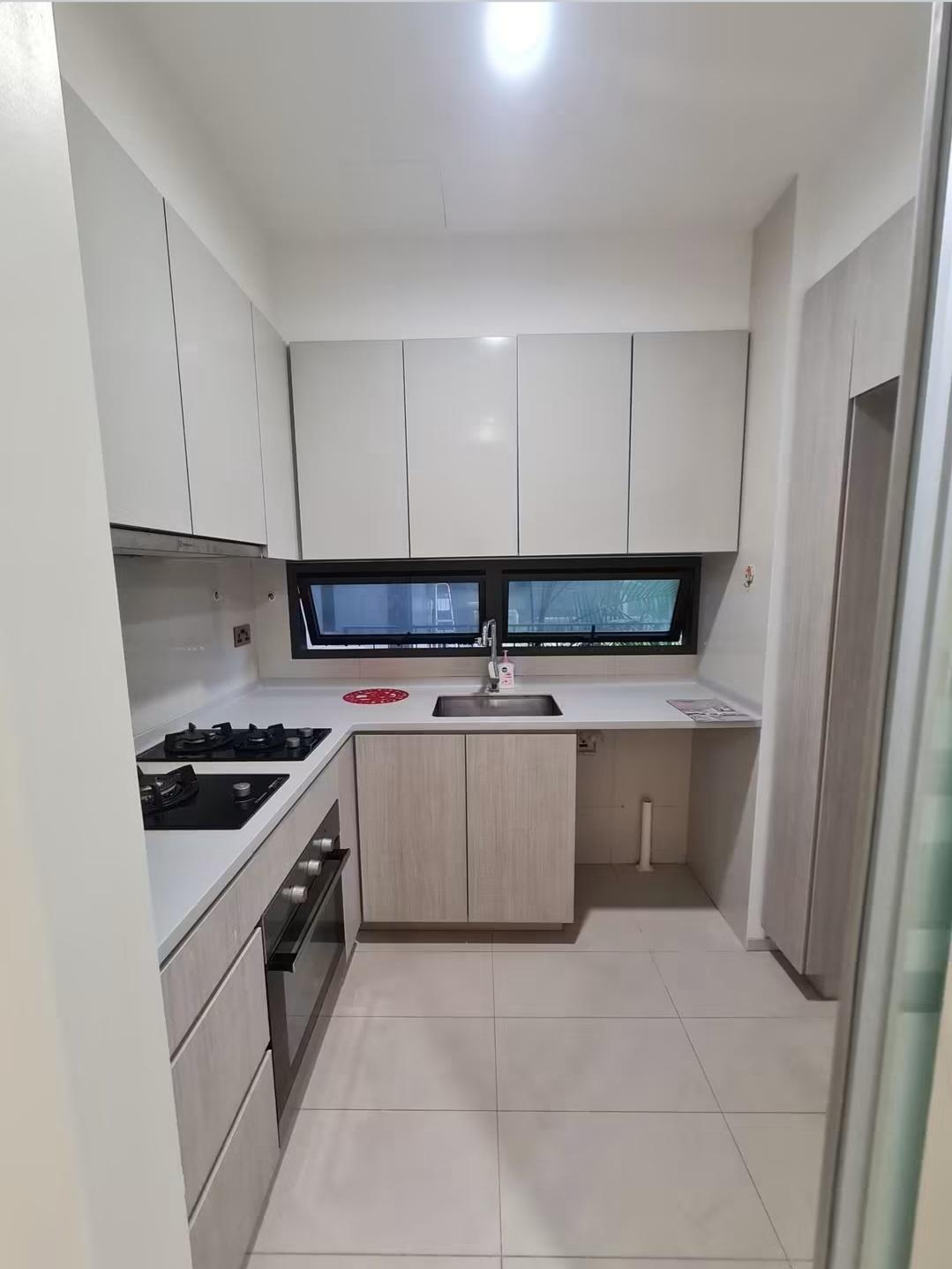 Kitchen with white cabinetry, gas hob and window