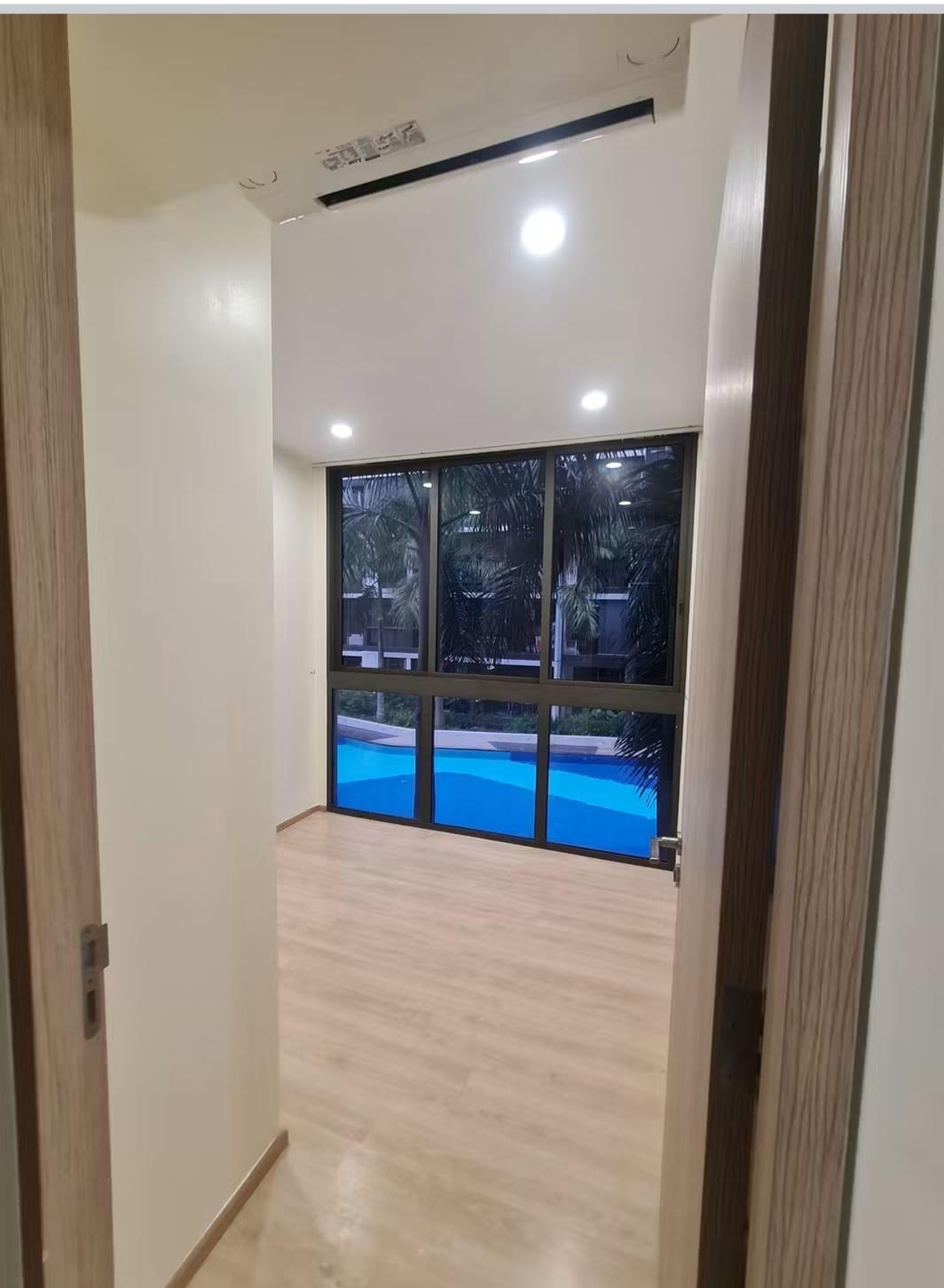 Hallway with air-conditioning and pool view through window