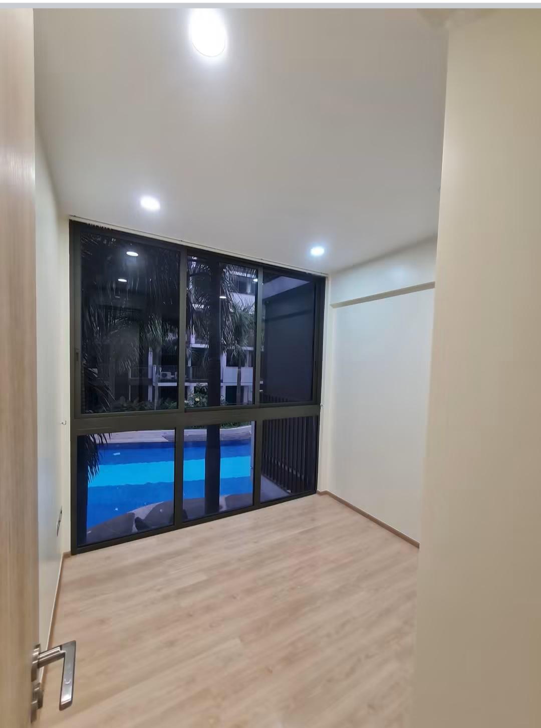 Bedroom window overlooking the pool at night